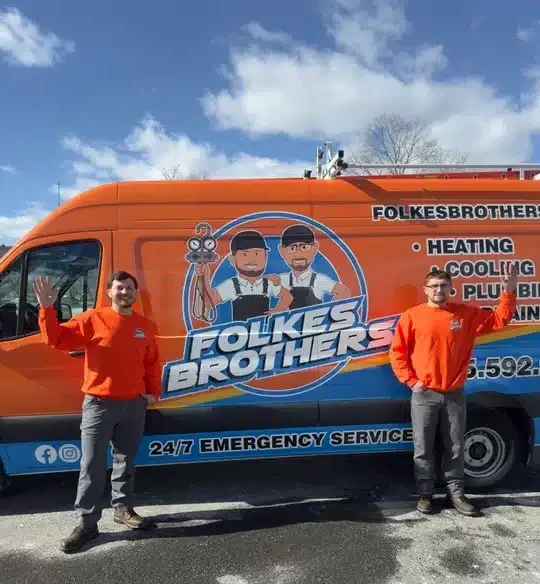 Folkes brothers techs in front of van