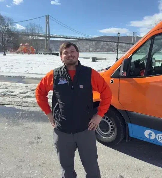 Folkes brothers tech in front of van