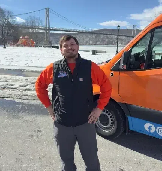 Folkes brothers tech in front of van
